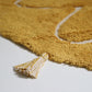 YVA Mangue tapis enfant bohème avec pompons nattiot-shop